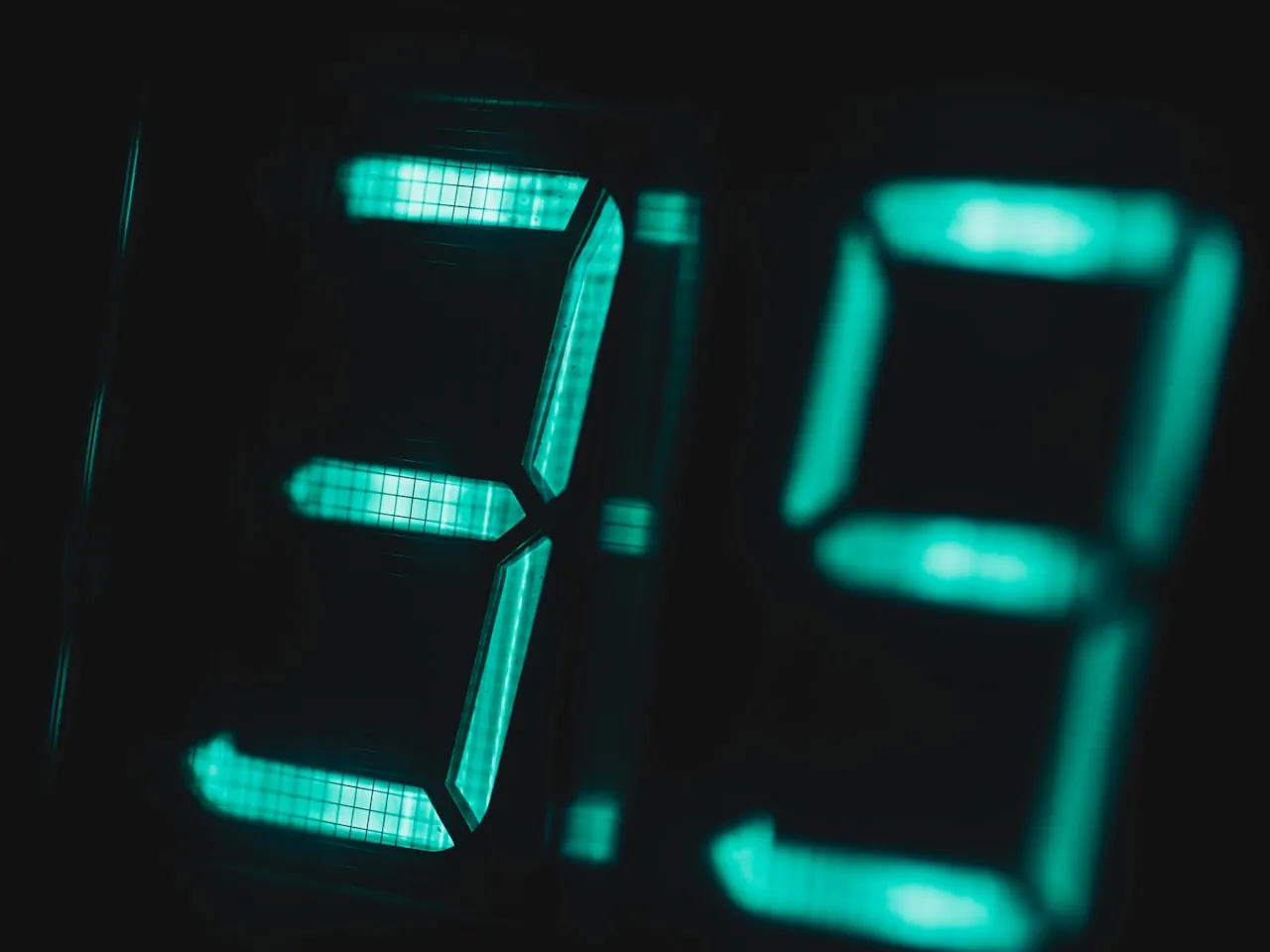 Close-up of a digital clock showing 9:19 with soft background blur