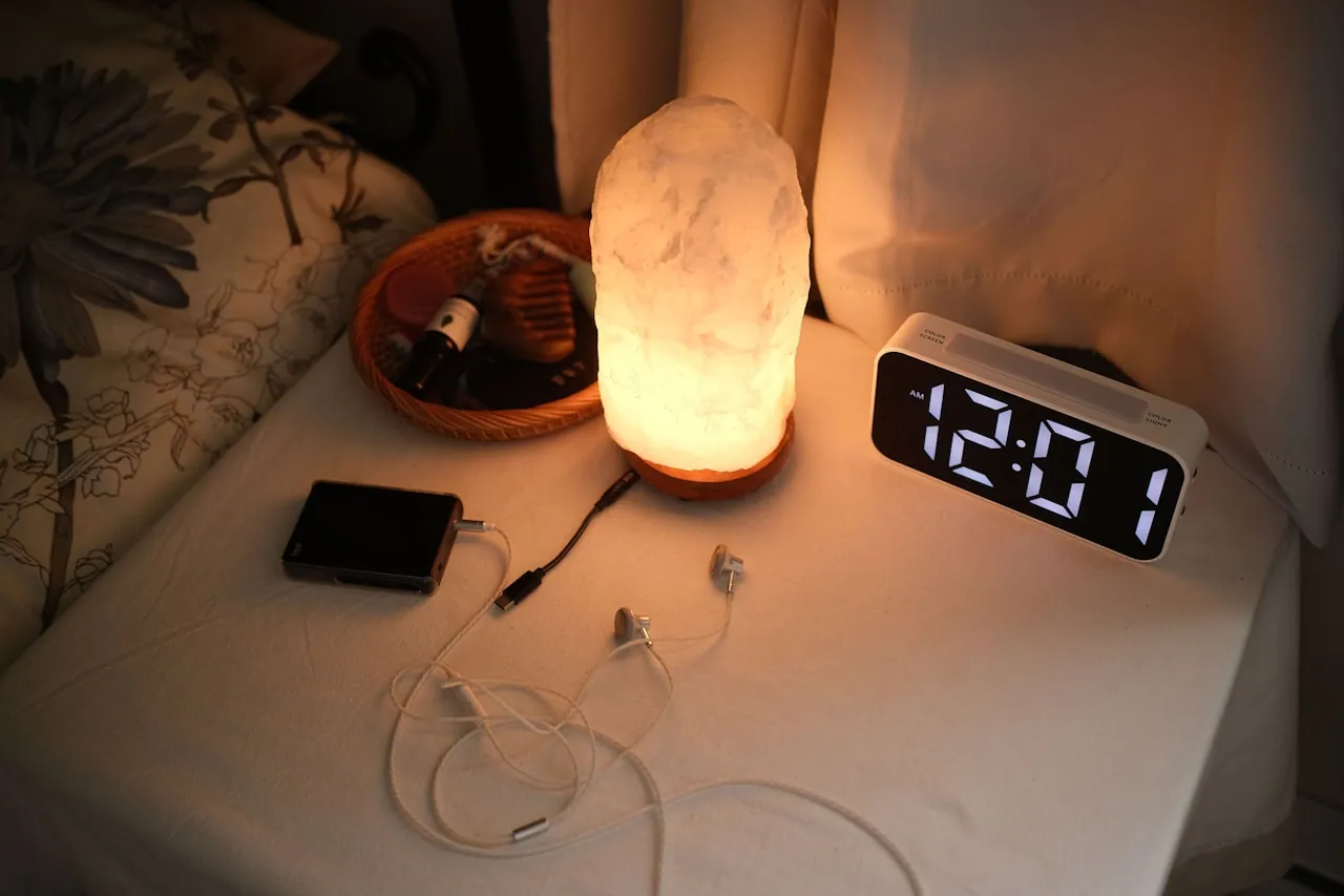 Digital clock reading 8:18 on a bedside table